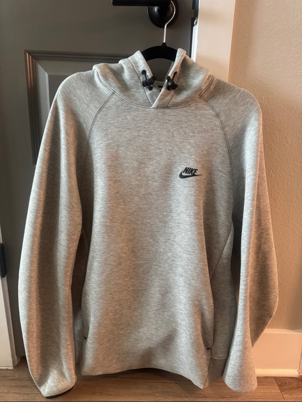 Nike Tech Fleece Light Heather Gray Pullover Hoodie with Small Black Swoosh